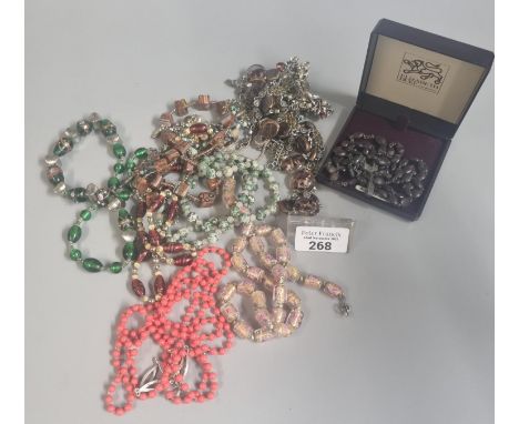Rosary and cross necklace, believed to have been found in the trenches in WWI.  Together with bag of assorted necklaces to in