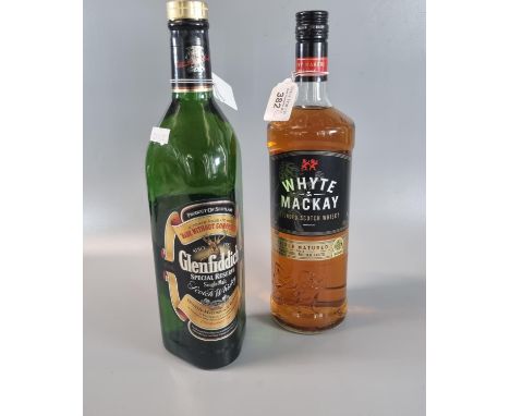Bottle of Whyte and MacKay blended Scotch Whisky.  1L.  40% vol. together with a bottle of Glenfiddich Special Reserve Single