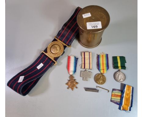 WWI brass shell case paperweight together with with a Royal R B Ordinance Corps belt and group of WWI medals to include: 1914