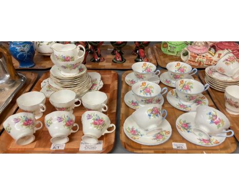 Set of six Shelley fine bone china floral tea cups and saucers together with a 21 piece Foley bone china tea set with floral 