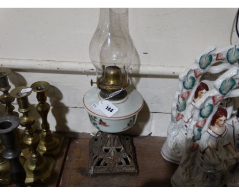         A Metallic Based Oil Lamp With Milk Glass Reservoir                             