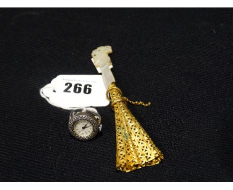         A Yellow Metal & Mother Of Pearl Button Hole Holder, Together With A Ladies Cocktail Watch Ring                      