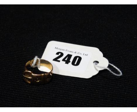         A 9ct Gold Buckle Ring                                                          