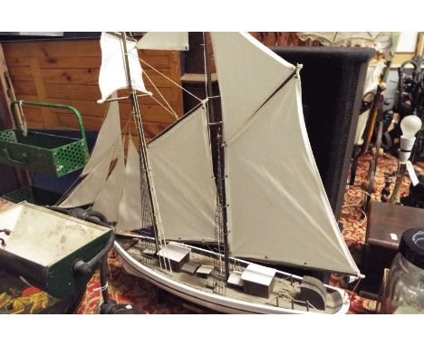 A model two-mast tall ship 'The Belle Poule' on stand