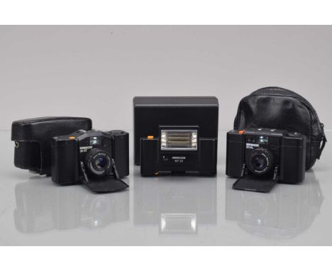 Two Minox 35 GT Compact Cameras, a Minox 35 GT, shutter working, meter responsive, self timer working, in Minox ERC, an untes
