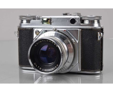 A Voigtländer Prominent Rangefinder Camera, 1956, double stroke camera, shutter working, rangefinder functions, body G, paint