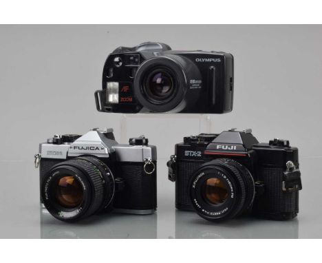 Three 35mm Cameras, a Fuji STX-2, shutter working, meter unresponsive, body G, with FM 50mm f/1.9 lens, G, Fujica STX-1, shut