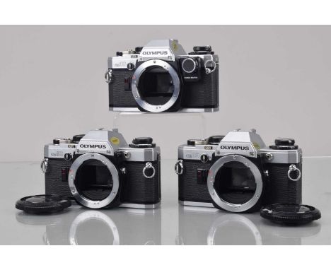 Three Olympus OM-10 Camera Bodies, one with manual adapter, shutter working, responsive in auto, meters responsive, self time