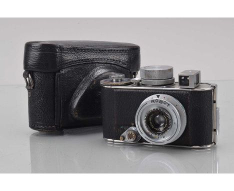 A Robot I Camera, serial no 17900, shutter working, spring drive working, body G, some brassing to dials, no leatherette to t