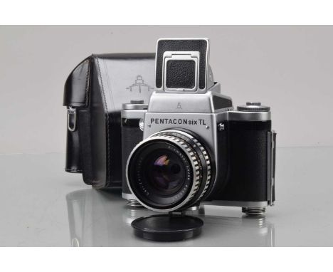 A Pentacon Six TL Medium Format Camera, shutter fires, one half of curtain missing, self timer working, body G-VG, with Carl 