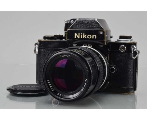 A Nikon F2 Photomic SLR Camera, black, serial no F2 7134533, shutter working, self timer working, body F-G, brassing to edges
