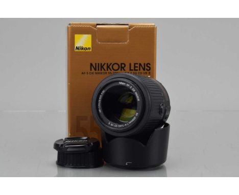 A Nikon AF-S DX Nikkor 55-200mm f/4-5.6 ED VR II Lens, auto focusing working, barrel VG, elements VG, with HB-34 hood, front 