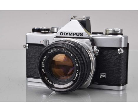 An Olympus OM-1n SLR Camera, shutter working, meter responsive, self timer working, body G, with F Zuiko 50mm f/1.8 lens, bar