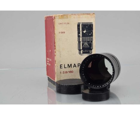 A Leitz Wetzlar Elmarit-R 180mm f/2.8 Lens, serial no 2456579, 1970, barrel G, elements G-VG, with front and rear caps, in wo