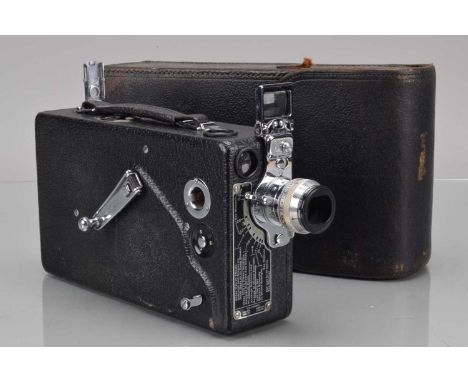 A Cine Kodak Model K 16mm Cine Camera, motor runs, body G, with Kodak Anastigmat 25mm f/1.9 lens, elements F-G, fungus, in ca