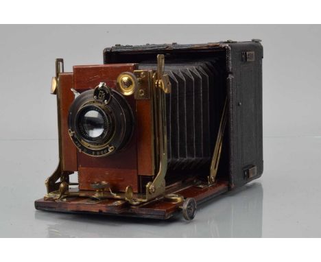 A Thorton Pickard Folding Ruby Camera, Kodak ball bearing shutter working, body G, some scuffs & wear, bellows G, with Akdis 