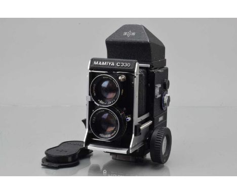 A Mamiya C330 Professional F TLR Camera, serial no D142163, body G, slight paint wear to back edges, large focusing wheel add