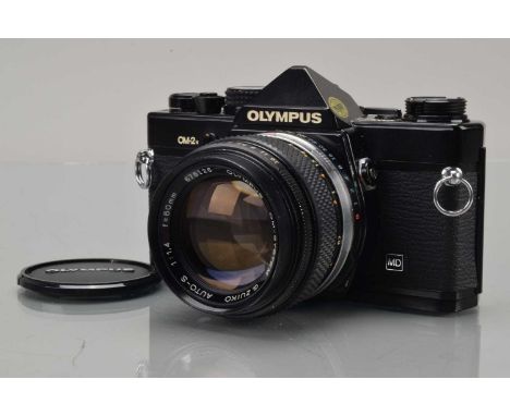 An Olympus OM-2n SLR Camera, black, shutter working, meter responsive, responsive in auto, self timer working, advance lever 
