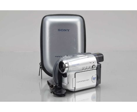 A Camcorder and Digital Camera, a Sony DCR-DVD201E, with battery, charger, remote, cables, manual, G-VG and a Canon Digital I