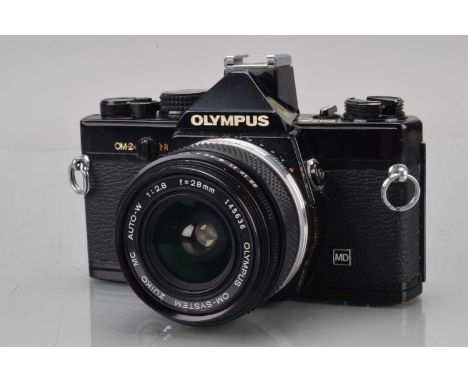 An Olympus OM-2n SLR Camera, black, shutter working, meter responsive, responsive in auto, self timer working, body F, brassi
