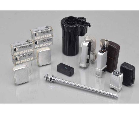 Minox Sub Miniature Camera Accessories,  a Minox daylight developing tank, table tripod, binocular attachment, C4 cube flash 