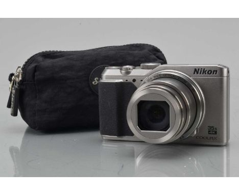 A Nikon Coolpix A900 Digital Camera, silver, shutter working, flash working, display working, body G, elements G-VG, with bat