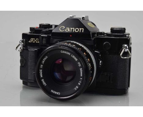 A Canon A-1 SLR Camera, black, shutter working (light shutter squeak), meter responsive, camera responsive in settings, self 