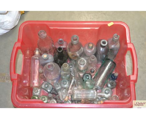 A box of vintage glass bottles