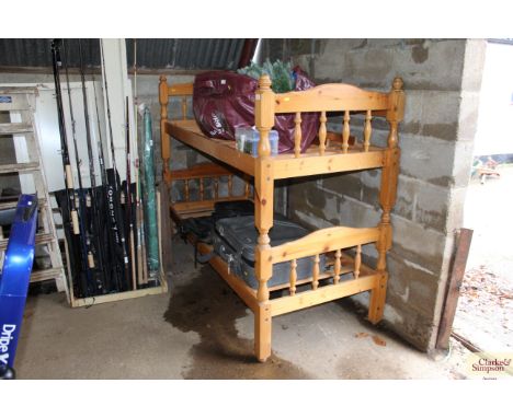 A pine bunk bed with ladder