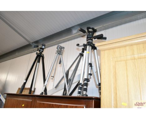 Three various camera tripods