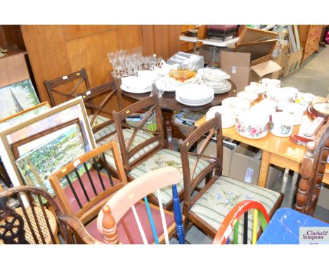 A set of four mahogany dining chairs with tapestry drop in seat raised on square tapering supports
