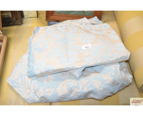 A bed spread and two pillow cases