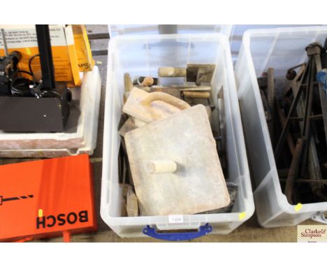 A plastic box containing various decorators tools 