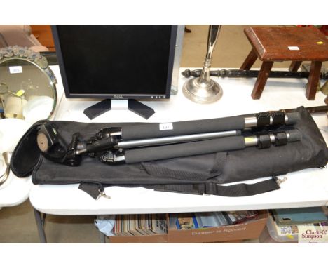 A camera tripod with carry bag