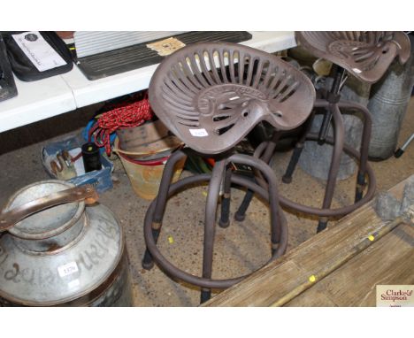 A heavy tractor seat stool (93)