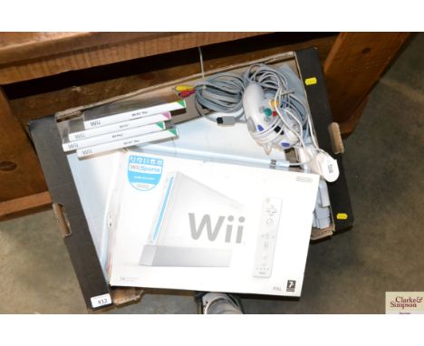 A Nintendo Wii console and accessories (sold as seen)