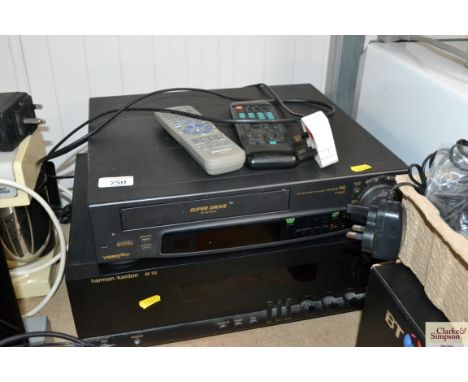 A Harman Kardon AVI100 amplifier and a Panasonic video player, both with remote controls