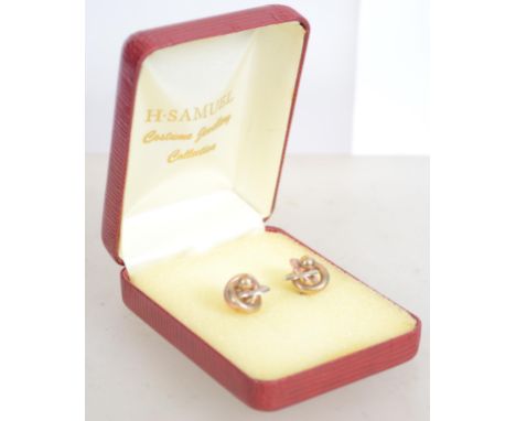 A pair of 9ct gold trilogy earrings of knot form with a central ball finial. Weighs 2 grams. Unmarked but tests as 9ct.