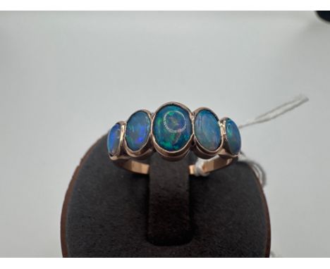 A five stone opal ring 9ct size Q 3.1 gms