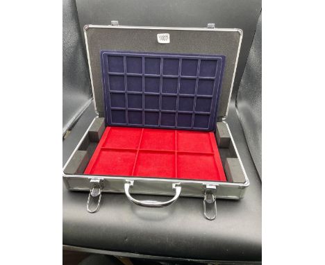 Metal coin briefcase in coin tray inserts