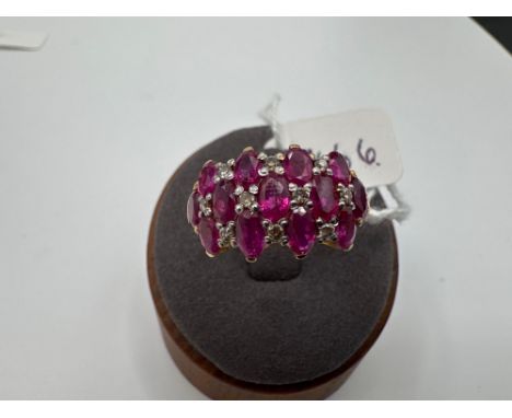 A RUBY AND DIAMOND CHEQUER BOARD DRESS RING IN HIGH CARAT GOLD 3.6 GMS