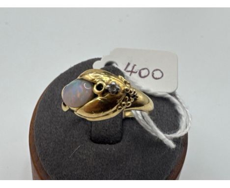 A OPAL AND DIAMOND SET RING 18CT GOLD 5.5 GMS