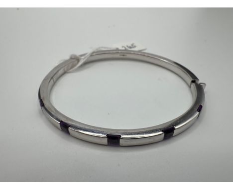 A DESIGNER FANCY CUT AMETHYST BANGLE SET IN WHITE GOLD 11 GMS