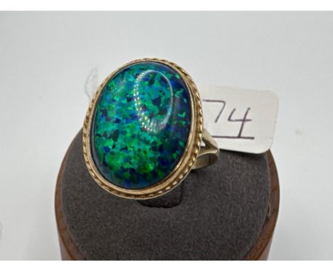 A large opal style ring 9ct size T 4.3 gms