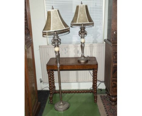 A standard lamp together with a matching table lamp