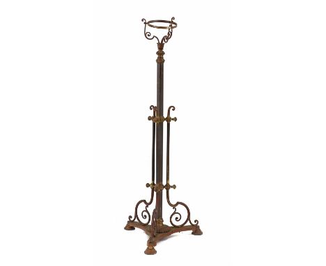 An Edwardian metal standard lamp,with a telescopic column, and a brassed painted finish, on a triform base,126cm high when no