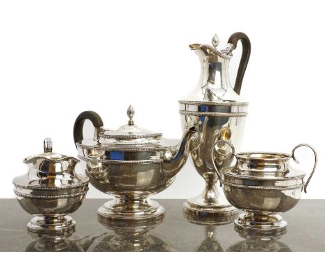 A four piece silver tea service,by WS and HS, London 1921, comprising a teapot, 19cm high coffee pot, 31cm high, twin handled