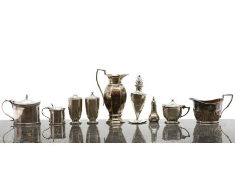 A group of silver cruet items,to include a set comprising a pair of pepperettes, 7.5cm high, and a mustard pot, 6cm high, Bir