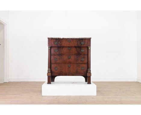 A French mahogany and marble topped commode chest, 19th century, the rectangular marble top above a frieze drawer and three l