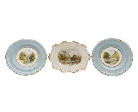 A group of three of Royal Crown Derby porcelain plates,by W.E.J. Dean, comprising a shallow dish with moulded edge and gilded